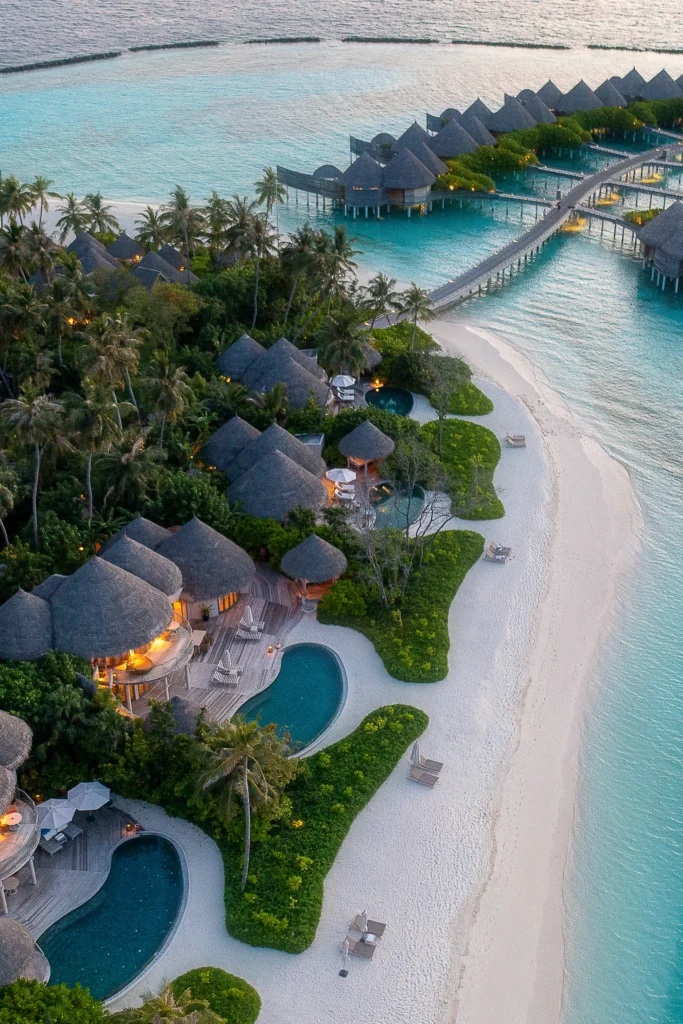 Overwater villas above a turquoise lagoon in the Maldives