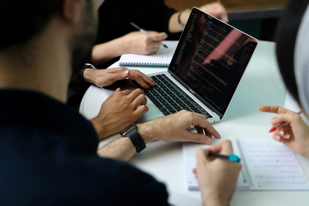 Travel professionals collaborating around a desk